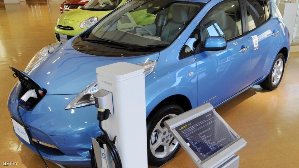 A Nissan Leaf electric vehicle is displa